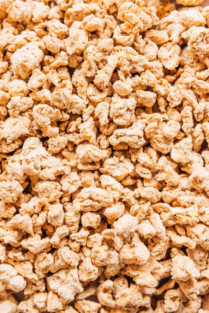 Textured Soy Protein Close-Up: Earthy Meat Substitute Wallpaper