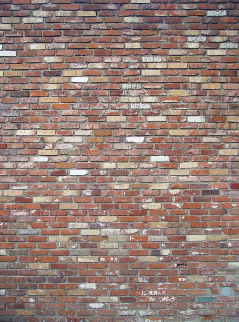 Textured Rustic Vertical Brick Wall Wallpaper Background in Red & Brown