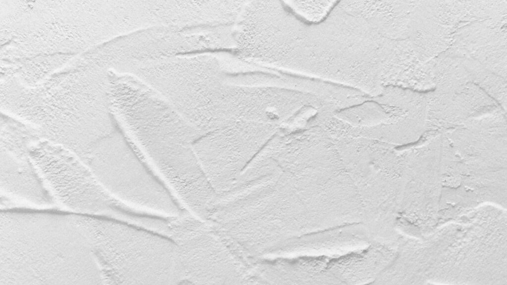 Intricate Textured White Wall: Minimalist Artistic Wallpaper Background