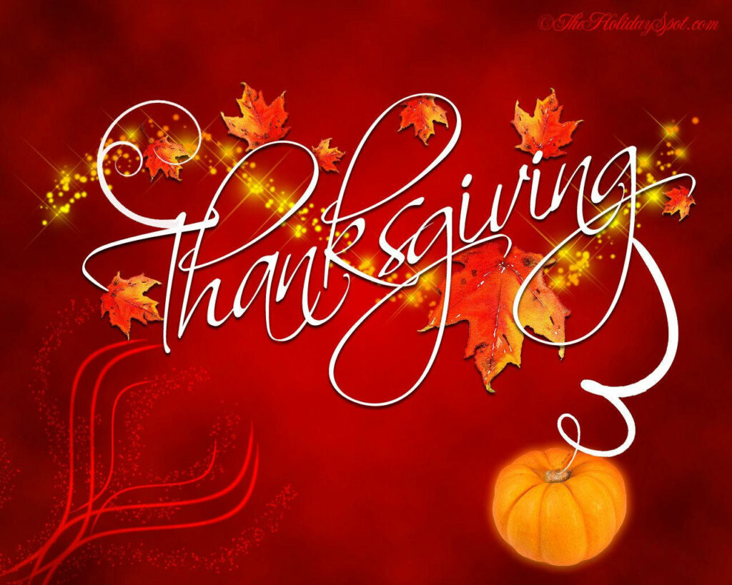 Thanksgiving wallpaper with elegant script text colorful autumn leaves and festive pumpkin background