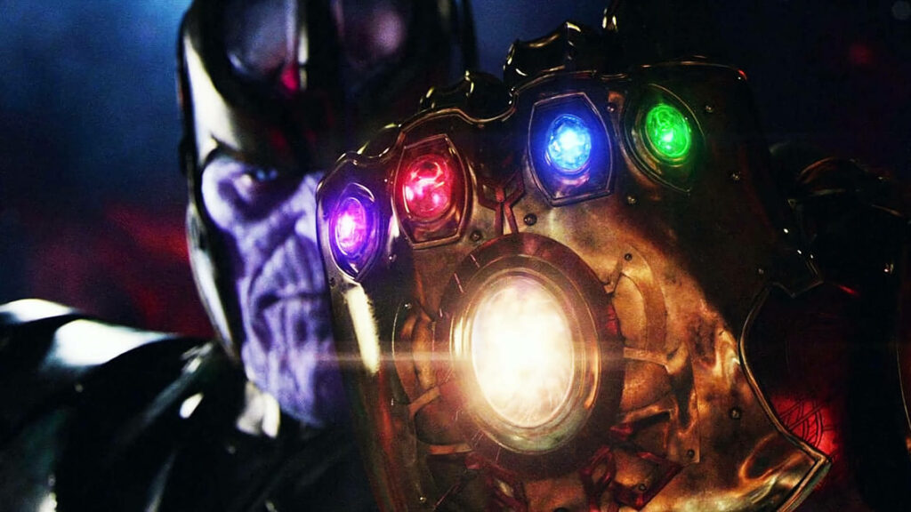 The Omnipotent Thanos: A Wallpaper of the Villain Wielding the Six Infinity Stones