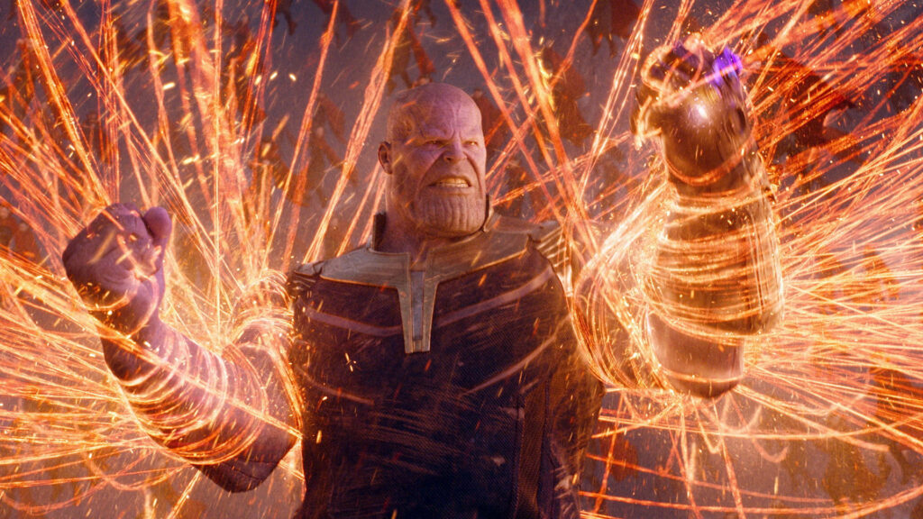 Thanos HD Wallpaper: Dynamic Golden Magic Clash Background