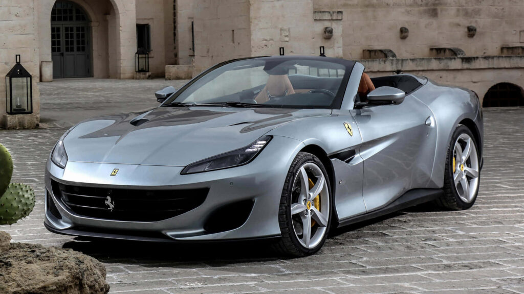 Embrace the Unparalleled Sophistication and Thrill of the Striking Red Ferrari Portofino: A Mesmerizing Blend of Beauty and Power Wallpaper