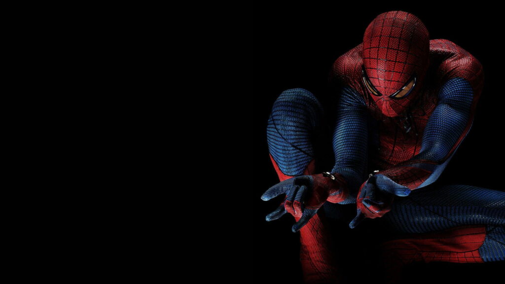 The Amazing Spider-Man poised to shoot webs in HD on dark background PC wallpaper.