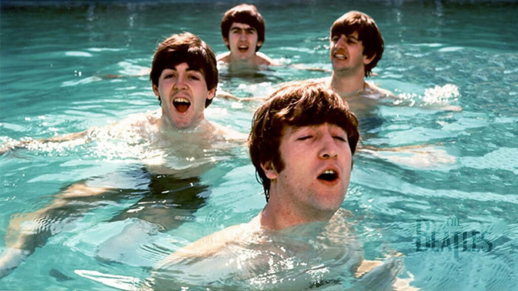 A Refreshing Serenade: The Beatles Harmonizing by the Poolside in the 1960s - HD Wallpaper Background
