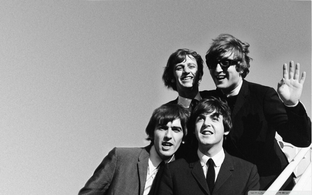 The Beatles classic black and white wallpaper featuring John Lennon Paul McCartney George Harrison and Ringo Starr