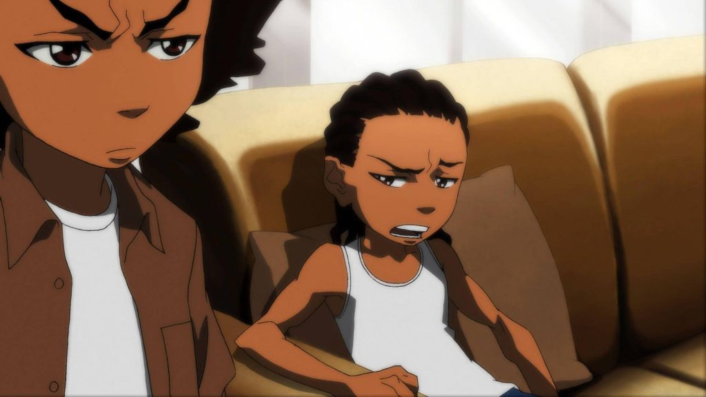 Huey and Riley Freeman from The Boondocks seated on couch with frustrated expressions wallpaper