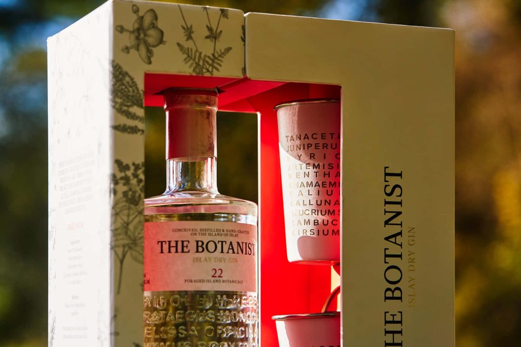 The Botanist Islay Dry Gin gift set with signature bottle and botanical packaging outdoors Wallpaper