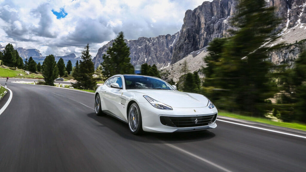 White Ferrari GTC4Lusso Against a Mountains Background Wallpaper