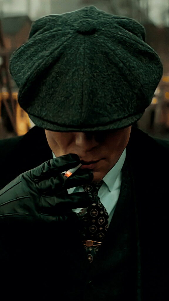 Gangster Suave: Thomas Shelby Donning His Iconic Cap in High-Definition Phone Wallpaper