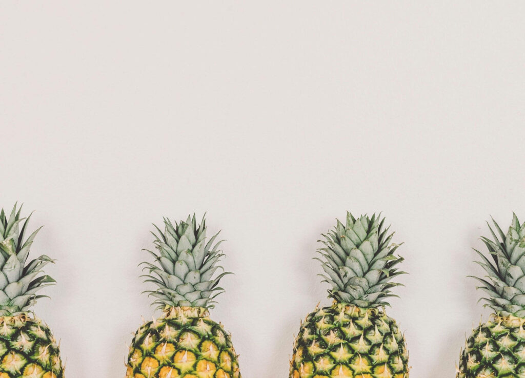 Pineapple Parade: A Vibrant Wallpaper of Colorful and Diverse Pineapples