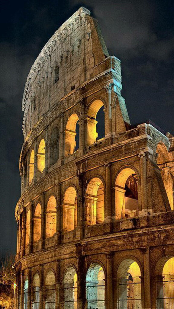 The Majestic Colosseum: Your Perfect iPhone Scenery Background with a Sip of Italian Charm Wallpaper