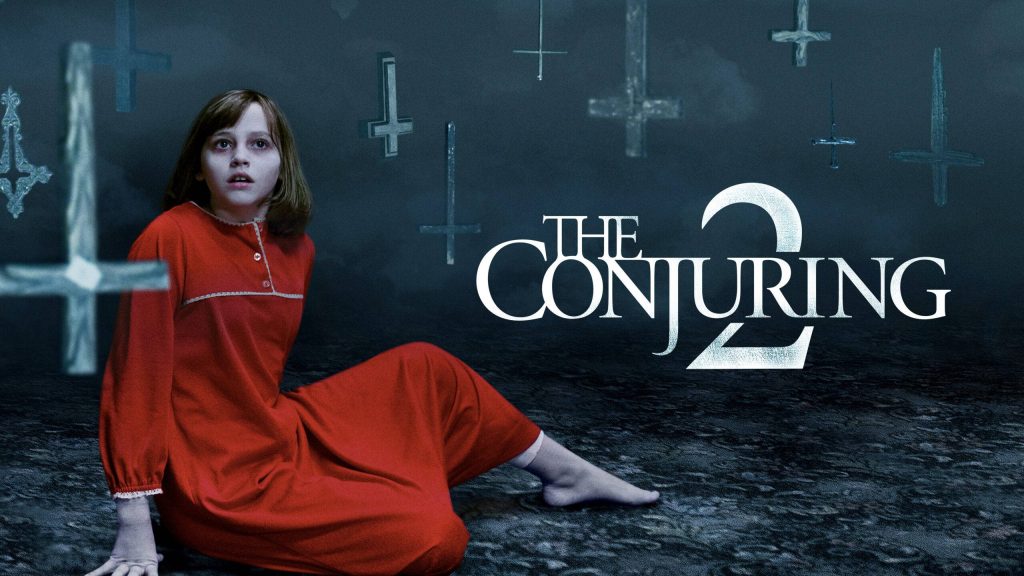 Janet Hodgson in red dress terrified with floating inverted crosses dark Conjuring 2 wallpaper