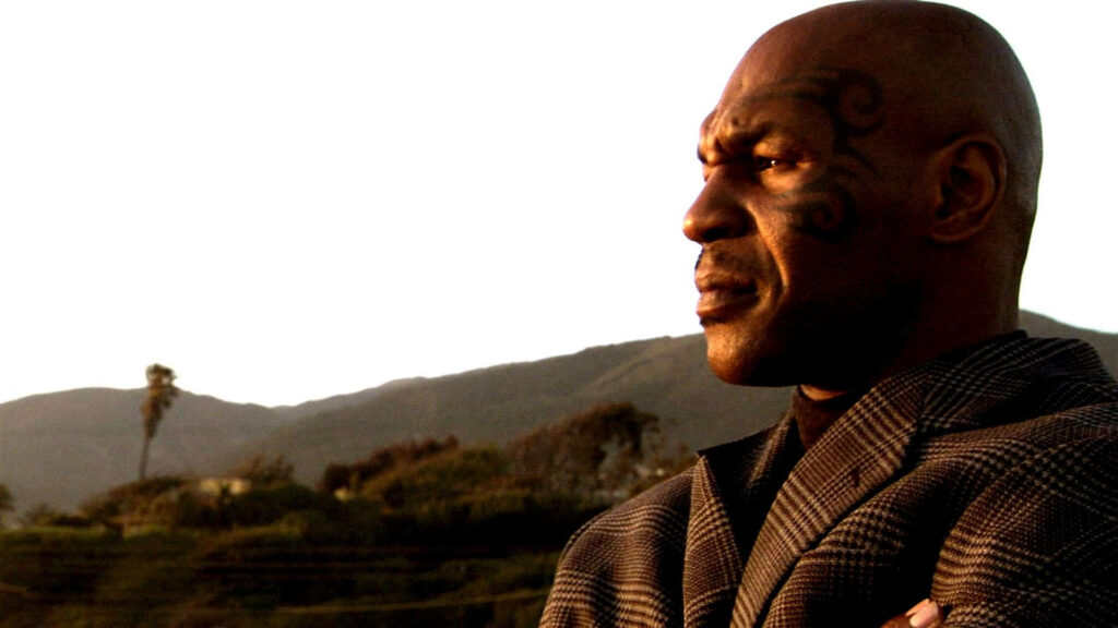 Contemplative Reflections: Mike Tyson Pondering amidst Nature's Canvas Wallpaper