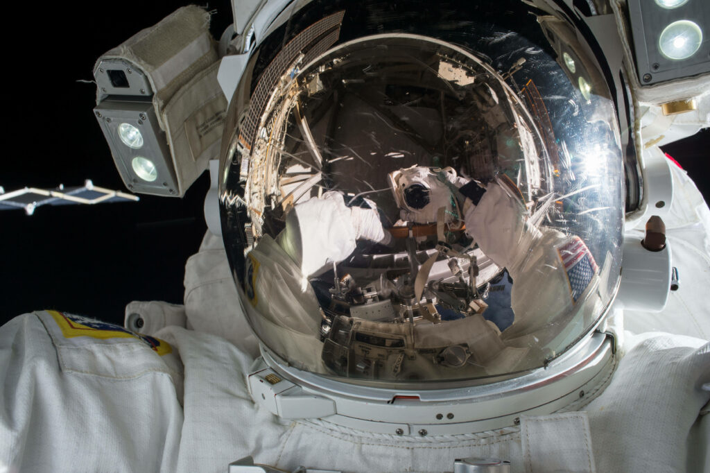 Exploring the cosmos: Close-up NASA aesthetic photograph of astronaut in outer space wallpaper