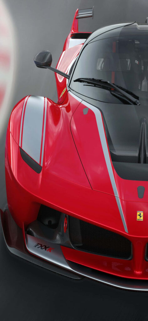 Revving Up in Style: The Verve of Max Ferrari and the Roar of a Red FXX-K Wallpaper