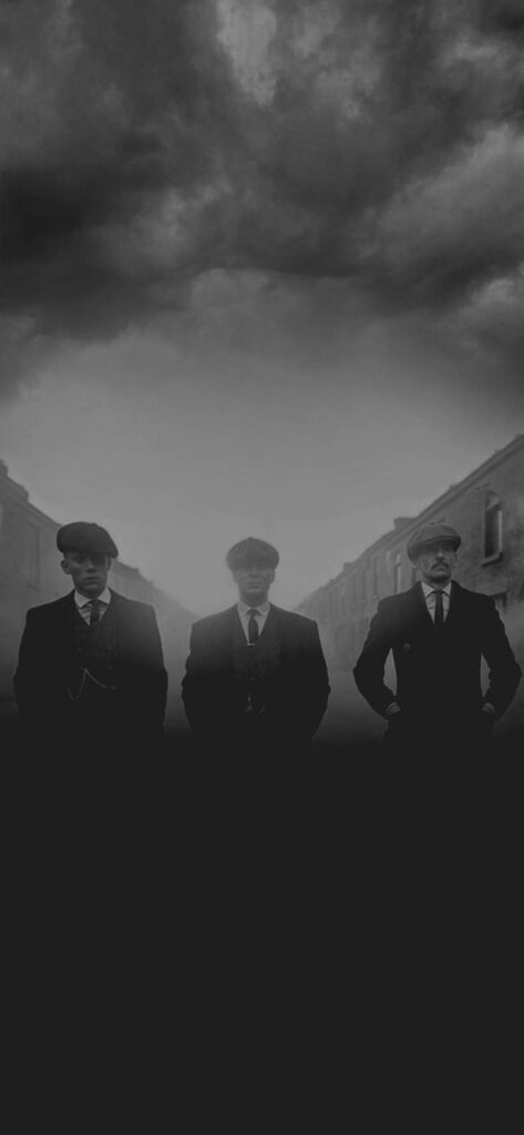 Iconic Peaky Blinders Trio: Brothers Rocking Their Signature Tweed Suits on Trendy Phone Wallpaper