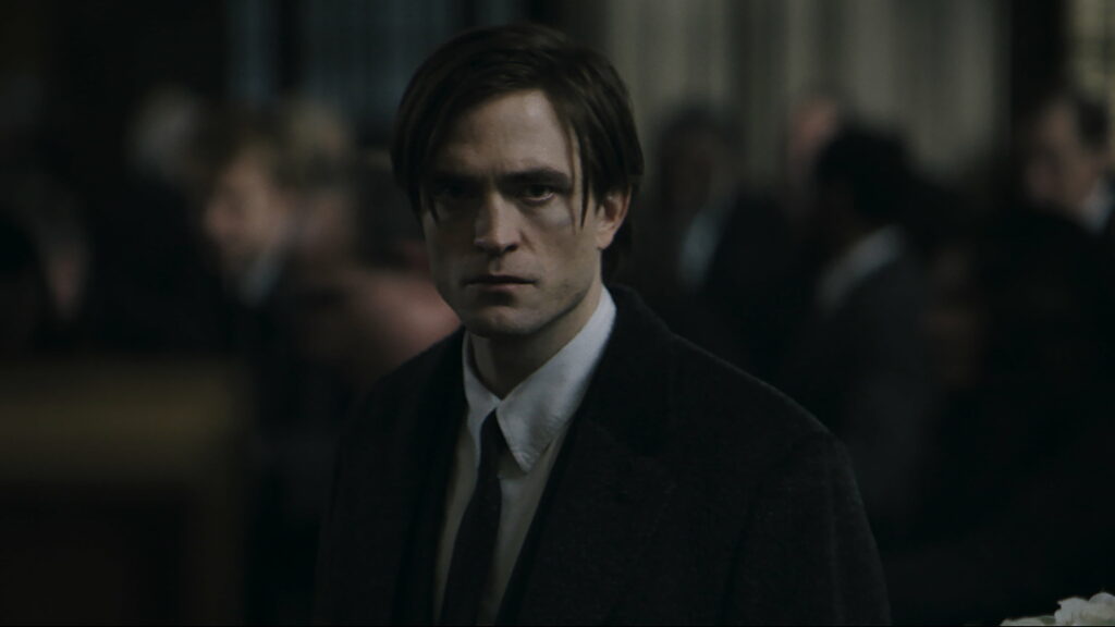 The Dark Knight Rises: Robert Pattinson Embraces Gotham's Grit in Captivating 4K Wallpaper