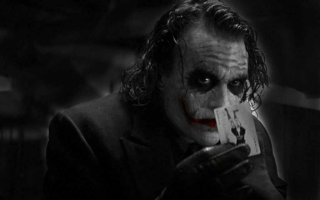 The Dark Knight's Iconic Joker: Heath Ledger's Sinister Transformation Wallpaper