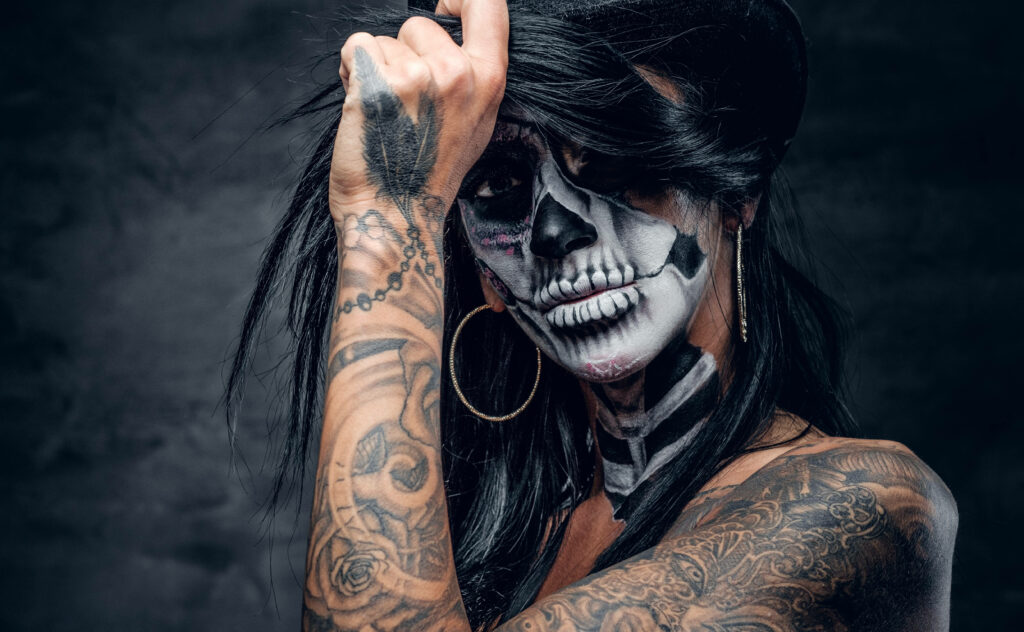 Bare Bones Beauty: HD Wallpaper of Skeleton Girl with Stunning Tattoo and Dramatic Makeup