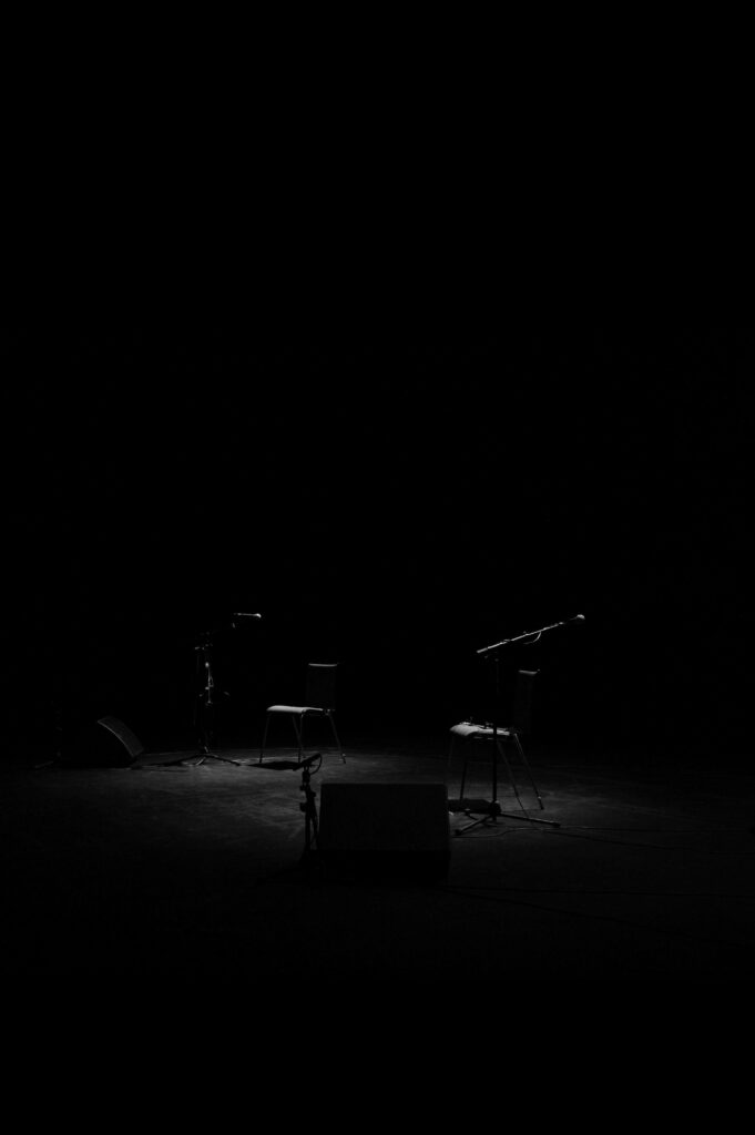 Ethereal Stage Setup: Captivating Darkness Adorns Spectacular Wallpaper