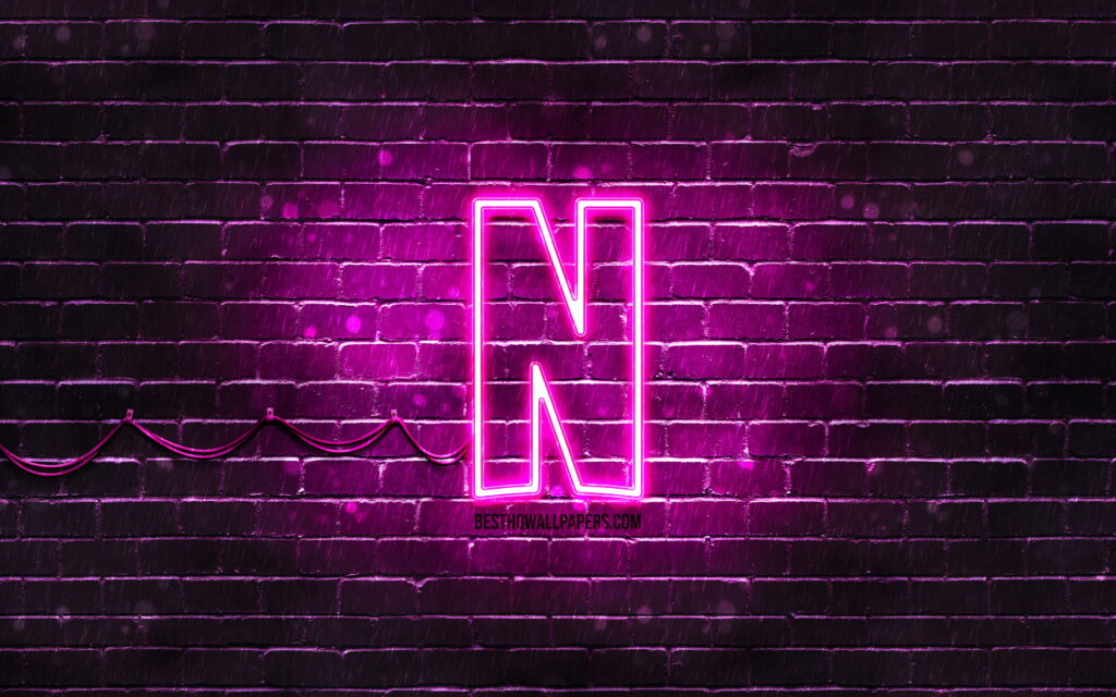 Purple Reign of Streaming: Netflix Logo Illuminates a Branded Brickwall in Neon Splendor Wallpaper