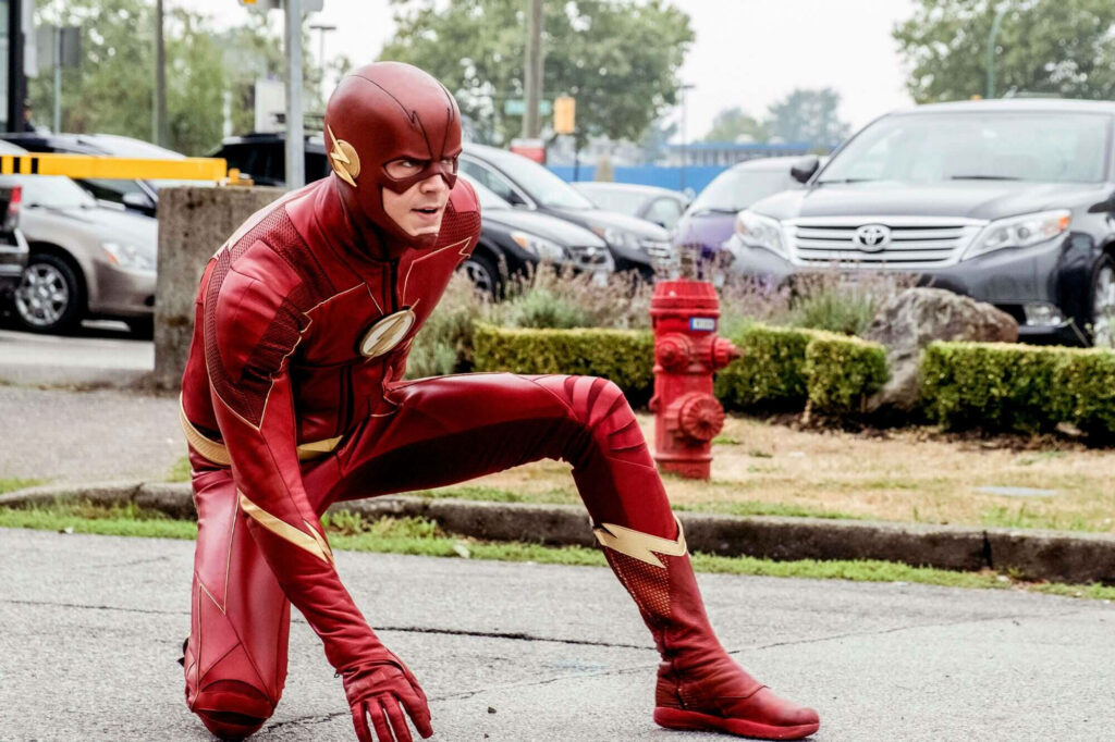 The Flash Wallpaper: Iconic Speedster Ready on the Street Background