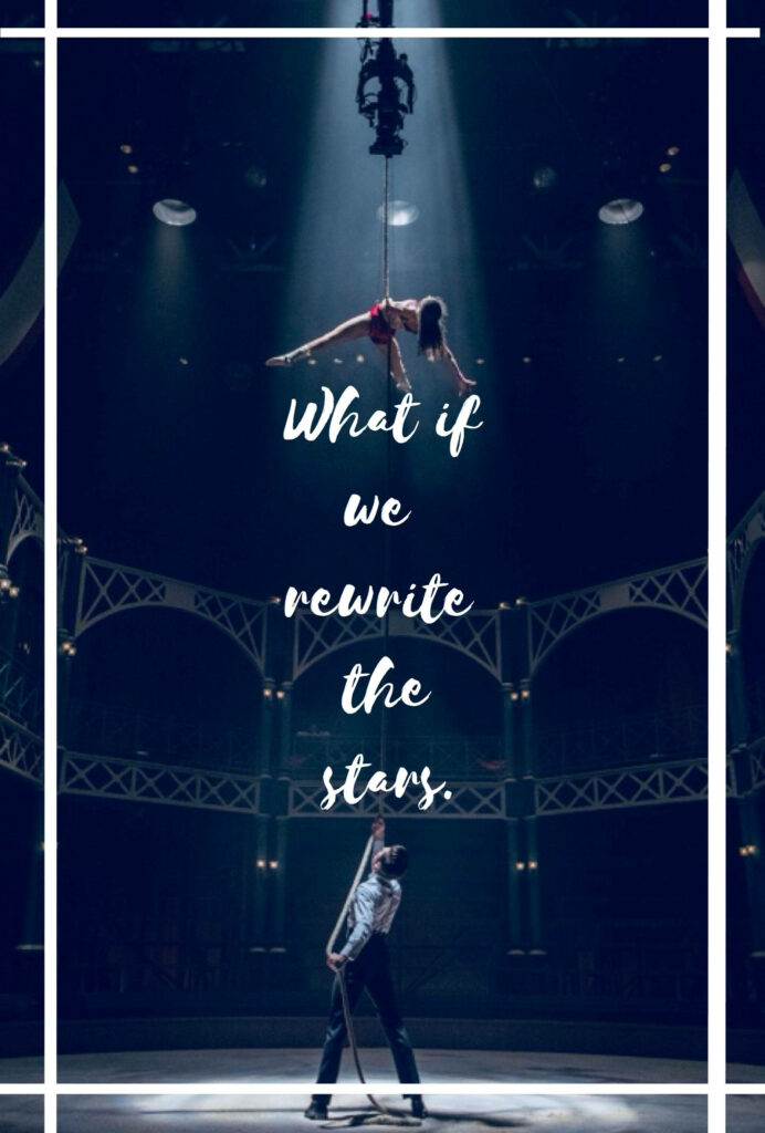 Dramatic Greatest Showman circus scene with spotlights and inspiring What If We Rewrite Stars quote wallpaper background