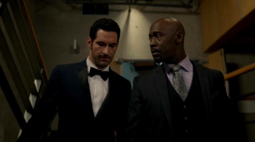 Men in Sharp Tuxedos: Suave Sophistication in Dramatic Setting Wallpaper