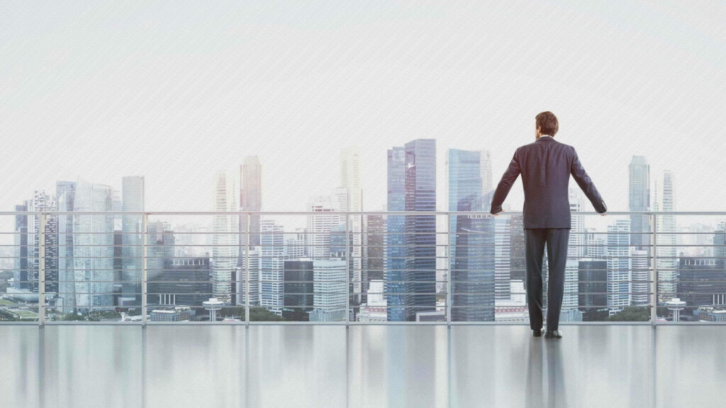 Lone Businessman Soaring Above the Cityscape Wallpaper