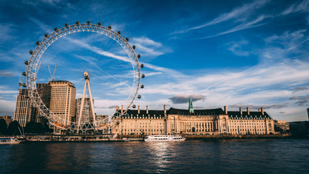 Looming Landmark: The London Eye Stands Tall beside the County Hall in Stunning Wallpaper