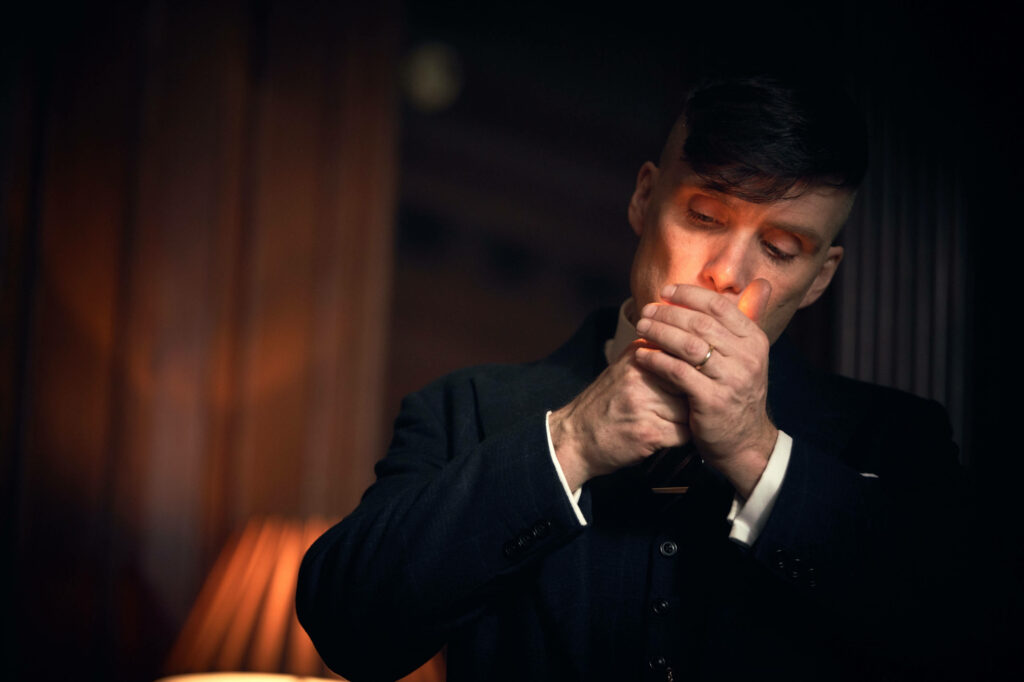 Dapper Tommy Shelby Captivates in a Smoky Peaky Blinders Masterpiece: A High-Resolution 8k Background Snapshot Wallpaper