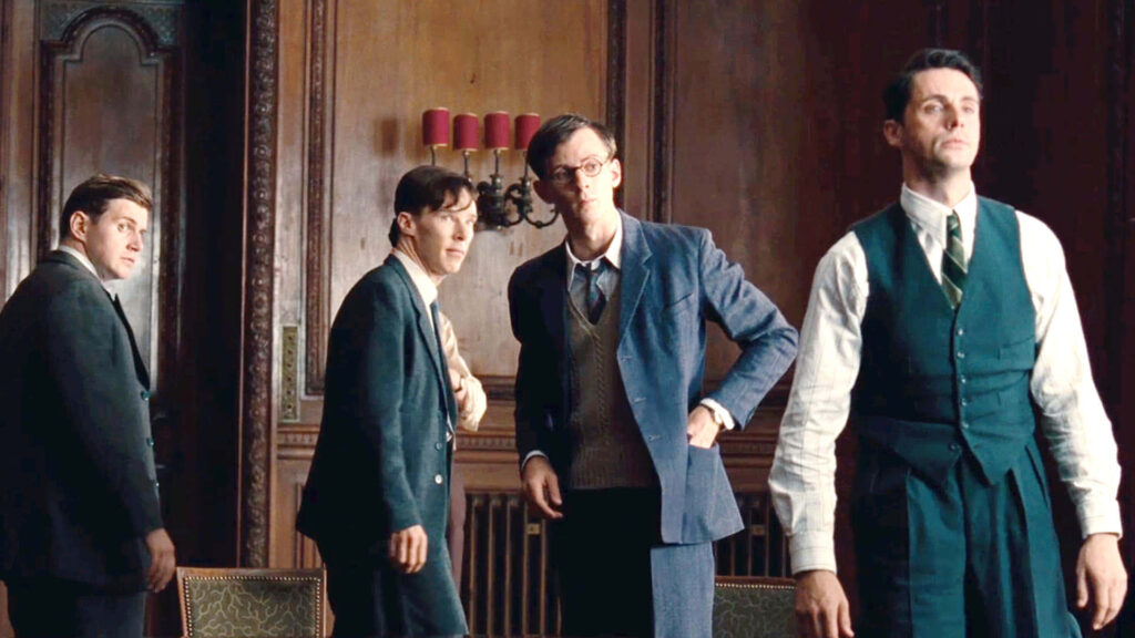 Alan Turing and team in wood-paneled room historic codebreaking scene wallpaper background