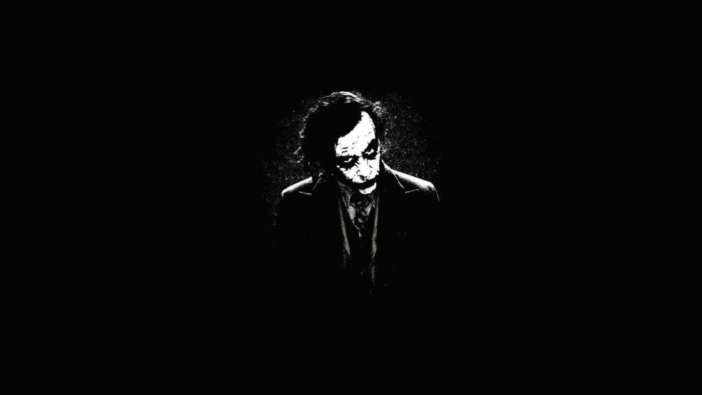 Intense Stare: Black and White Joker Portrait Wallpaper