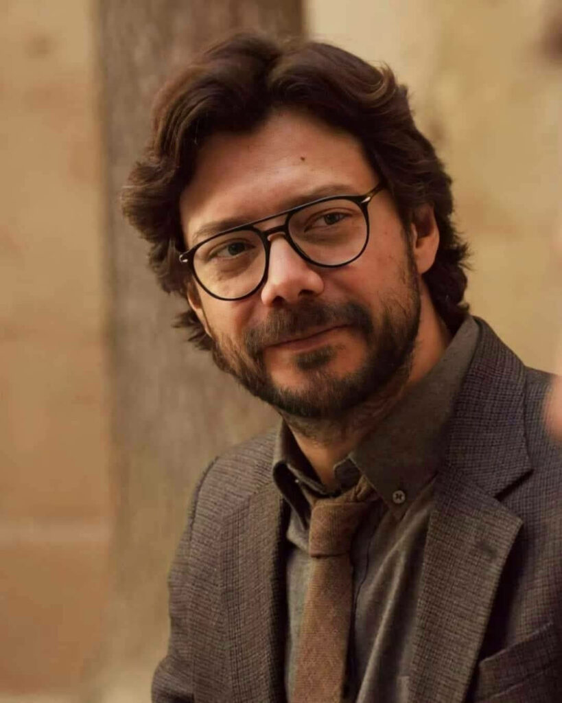 The Resolute and Stylish Professor: A Captivating Glimpse into the Mind Behind the Money Heist Wallpaper
