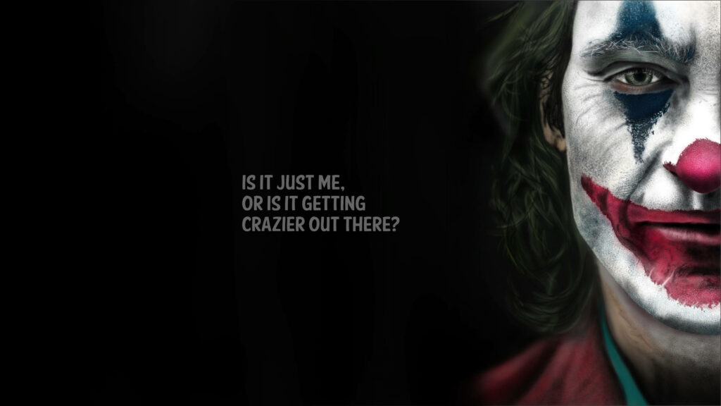 Joker's Maniacal Masterpiece: 4k Ultra HD Wallpaper featuring Joaquin Phoenix with a Centrally Placed Movie Quote