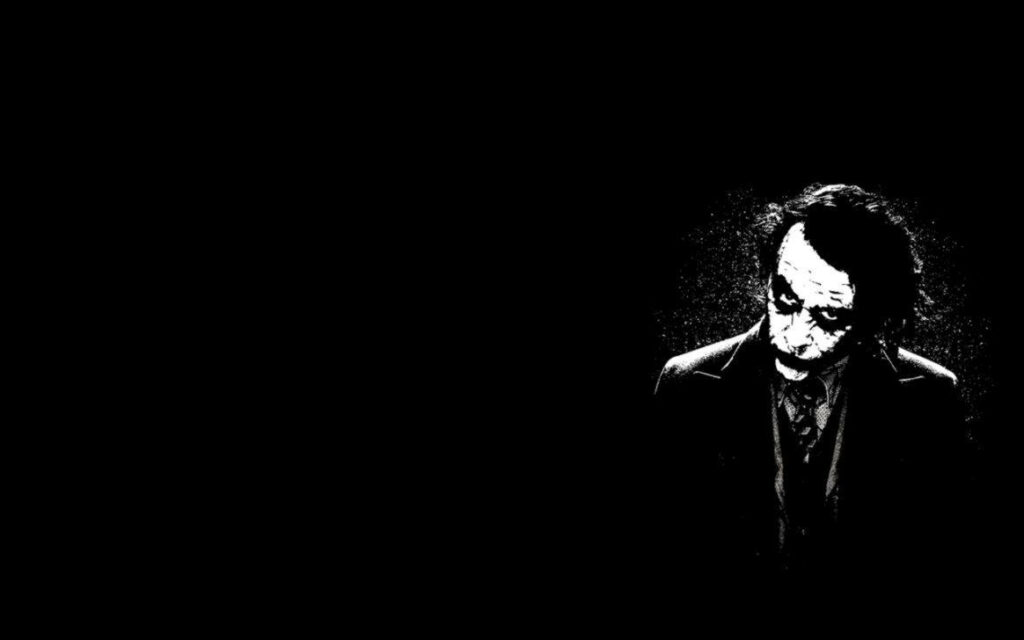 The Mysterious, Dark Joker: A Stylish HD Wallpaper with a Cool Black Background
