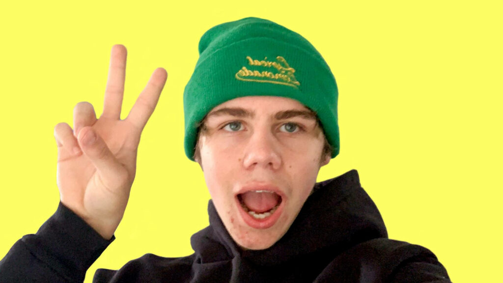 Cheerful Kid LAROI Wallpaper: Peace Sign & Bright Yellow Background