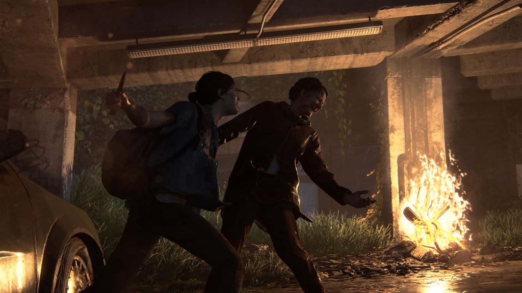Ellie battles fiercely in a dark fire-lit ruin in The Last of Us Part II cinematic wallpaper