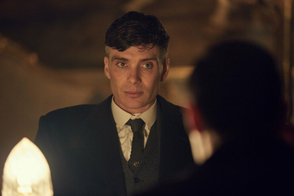 Gritty Gangster: Cillian Murphy as Thomas Shelby in Peaky Blinders - Captivating QHD Wallpaper