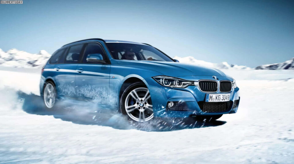 Blue BMW M Series Car on Snowy Mountain Background Wallpaper