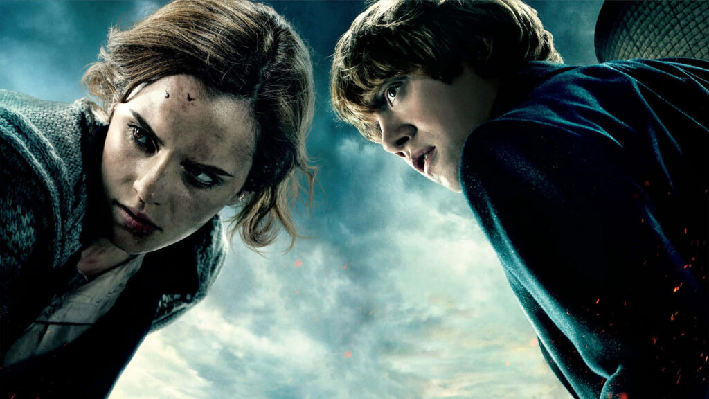 Enchanting Harry Potter Landscape: Ron and Hermione Embrace Against Majestic Wallpaper Backdrop