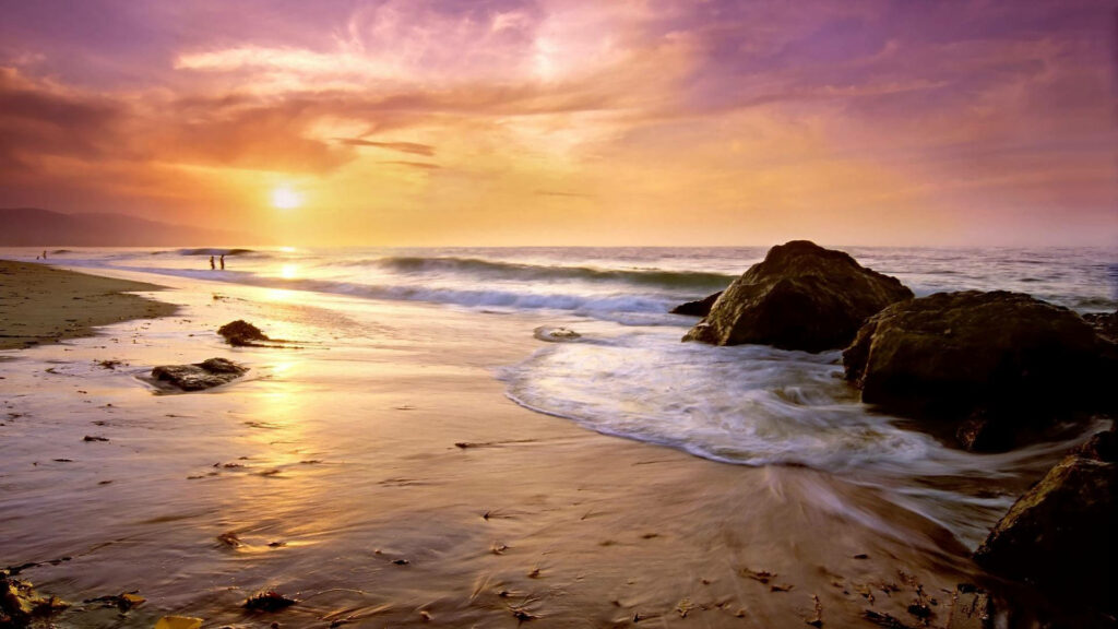 Sunset Serenade at Malibu Beach: The Majestic Rock Formations Steal the Show Wallpaper