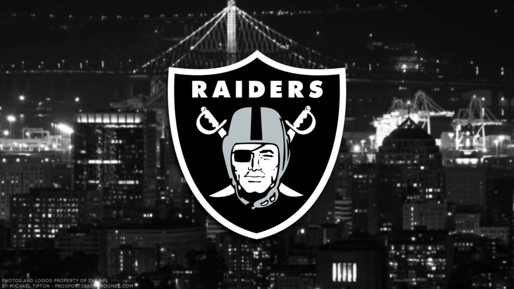The Mighty Raider's Mark: Enigmatic Emblem Engraved Across Oakland's Urban Skyline Wallpaper