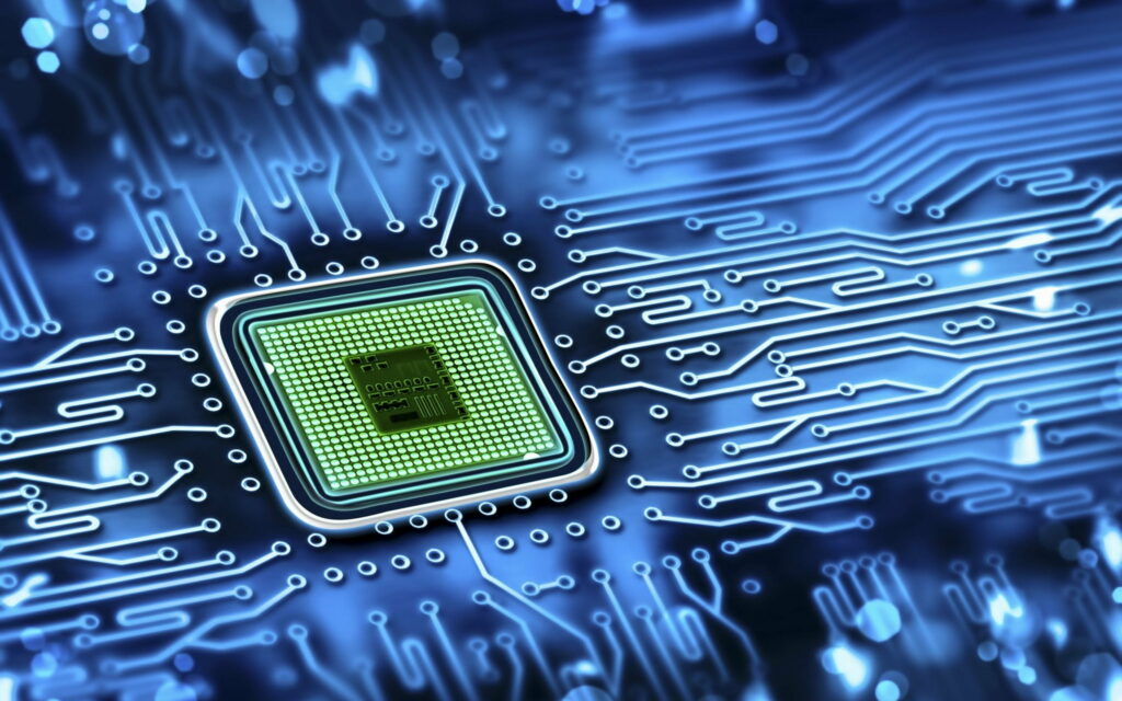 The Heart of High-Tech: A Captivating QHD Wallpaper Featuring a Powerful Processor and Motherboard