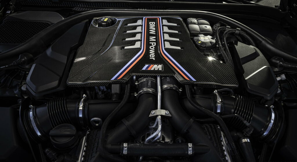 Raw Power Unleashed: Captivating 2022 BMW M5 CS Engine Roars in QHD Car Portrait Wallpaper
