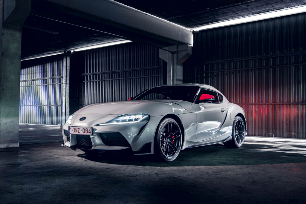 Speeding Through the Night: Titanium White Toyota Supra Car Wallpaper