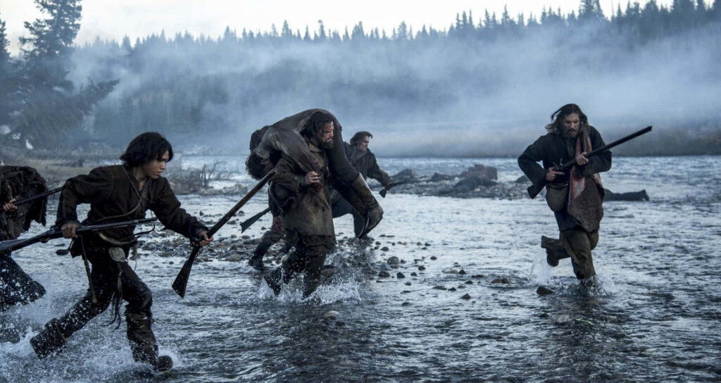 Fur trappers crossing icy river in misty forest wilderness intense survival scene wallpaper