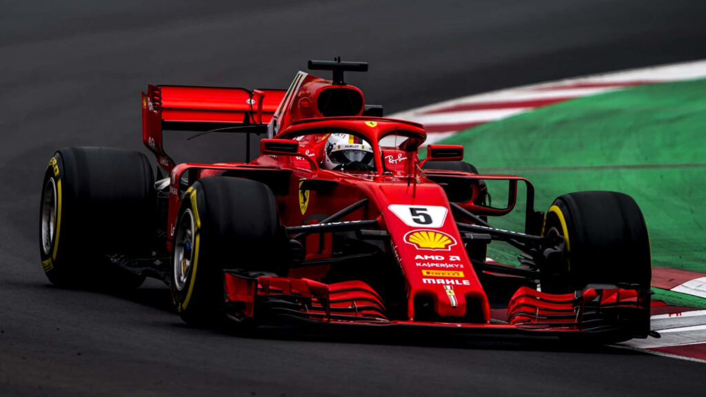 Burning up the Track: Sebastian Vettel Dominates in the Electric Red SF71H - F1 2018 Wallpaper