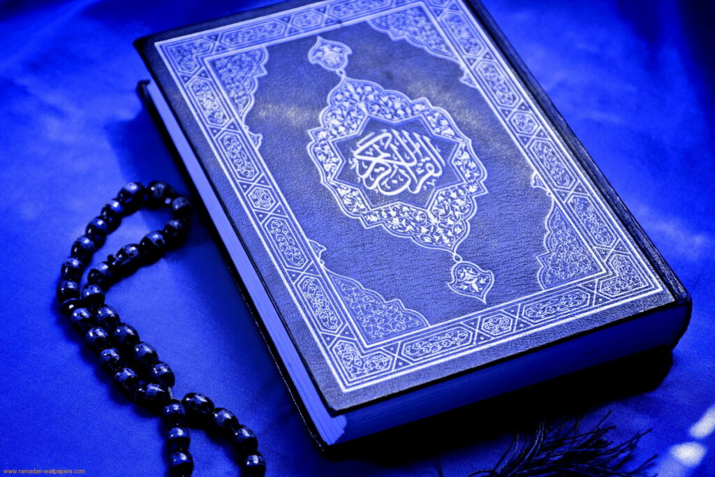 The Majestic Holy Quran: A Mesmerizing HD Wallpaper of Islam's Beautiful Blue Al-Quran